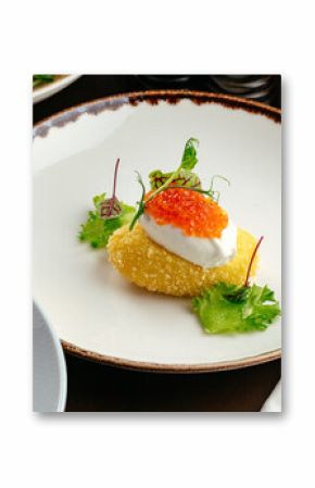poached egg with cutlet and caviar