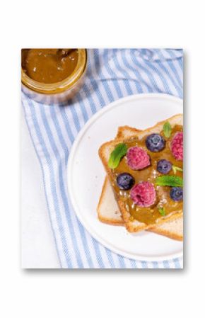 Pistachio paste toast. Summer breakfast delicious sandwiches with pistachio butter spread, with fresh berries. Balanced healthy vitamins and macronutrients snack