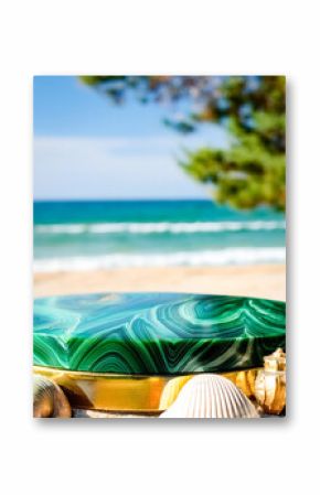 Green Malachite Stone Podium on Sandy Beach With Ocean Blur Background