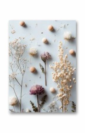 Pastel-toned arrangement of dried flowers and small spheres