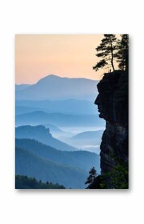 Stone Face Cliff Overlooking Misty Mountain Range at Sunrise in Bohemian Switzerland National Park