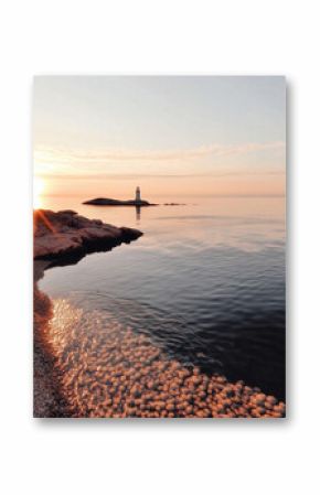 photo of calm ocean, natural warm colors. lighthouse, seashore, sand, beach