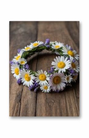 Floral crown made with daisies and lavender on rustic wooden surface for celebration or decoration