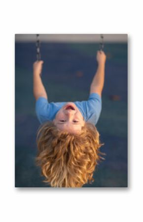 Funny child boy on swing. Kid swinging on playground. Cute excited amazed child on swing. Cute child swinging on a swing. Crazy playful child swinging very high.