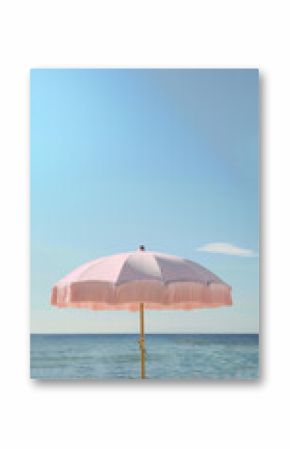 Retro pretty pink beach fringe umbrella parasol sand beach with windy sea waves cloud sky earthy natural color vacation relaxation seaside coast resort ocean vibes eco summer holiday tropical campaign