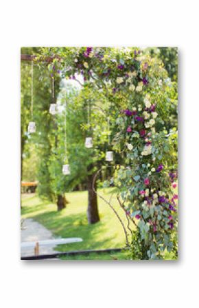 wedding arch with hanging burning candles