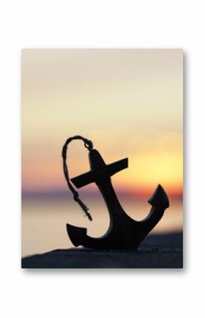 Sunset Reflections with a Wooden Anchor by the Sea