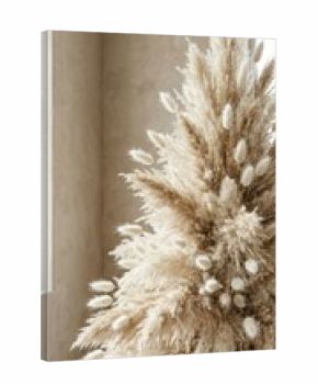 Pampas grass Christmas tree standing tall in neutral room with window light. Natural dried grass holiday decoration for boho home interior. Sustainable winter festivity and minimalist yuletide