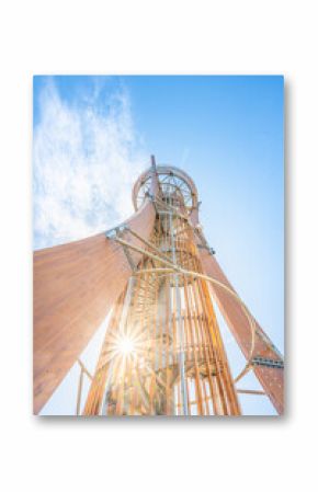 The distinctive Hamstejn lookout tower stands tall in Bohemian Paradise, featuring a spiral staircase and a unique steel tube design. Visitors can admire sweeping views of the landscape.