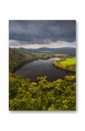 Vltava river meander on Slapy dam with dramatic storm sky. Czech autumn landscape