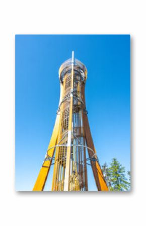 The Hamstejn lookout tower features a steel structure with a spiral staircase, offering stunning views of the Bohemian Paradise landscape on a clear day. Visitors can climb and enjoy the scenery.