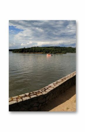 Houseboat floating on orlik reservoir near orlik nad vltavou castle in czechia in july