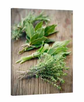 Fresh herbs on wooden surface