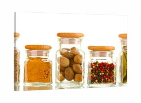 powder spices in glass jars  isolated on white