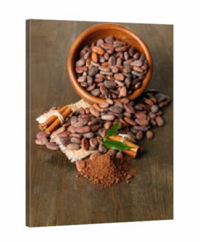 Cocoa beans in bowl, cocoa powder and spices