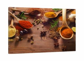 Spices and herbs on wooden table.