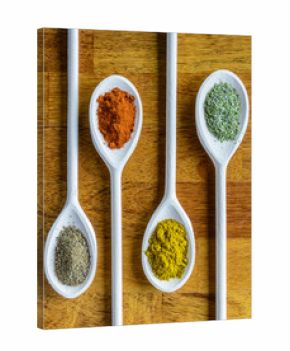 Collection of various food ingredients in wooden spoons