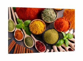 Variety of spices and herbs on kitchen table