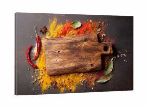 Various spices spoons and cutting board