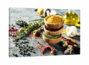Spices and herbs on wooden background