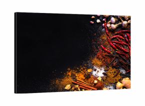 Variety Spices and herbs on black stone background, Top view with empty space background for texture. Italian food, eastern food concept.