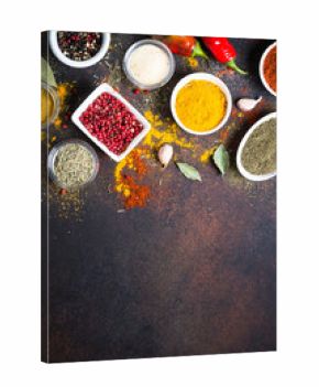 Various spices in a bowls on stone table. Top view with copy space.