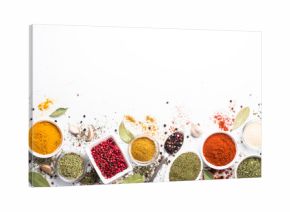 Various spices in a bowls on stone table.
