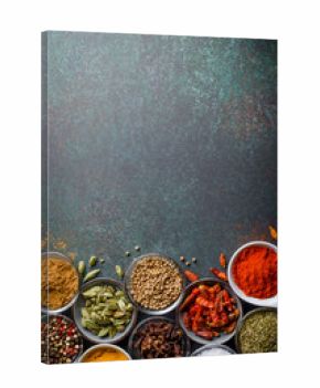 Various spices in glass bowls