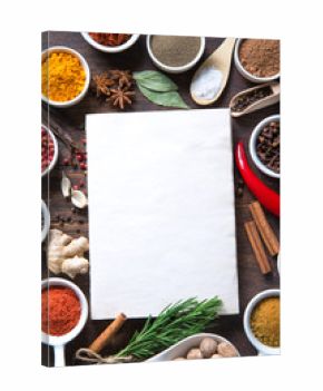 Colorful herbs and spices selection. Aromatic ingredients on wood table