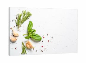 Spices and herbs over white stone table top view. 