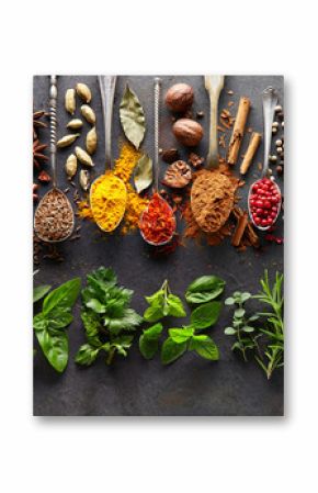 Spices and herbs on black board