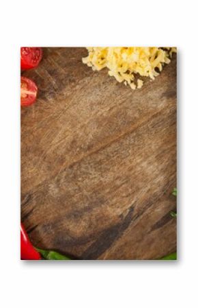 Halved tomatoes with spices in wooden container