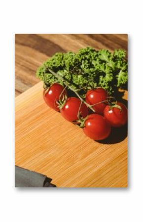 Tomatoes and parsley on chopping board