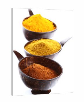 spices - pile of bright Madras Curry Powder and 2 bowls behind