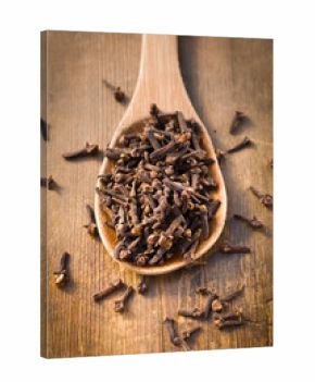 Close-up of cloves in a wooden spoon