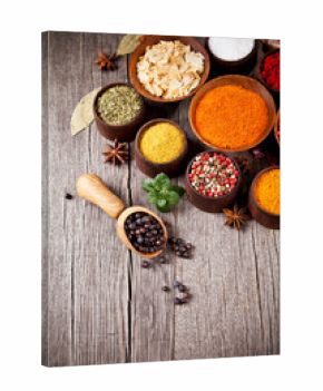 Various kind of spices in wooden bowls