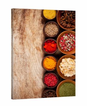 Various kind of spices in wooden bowls