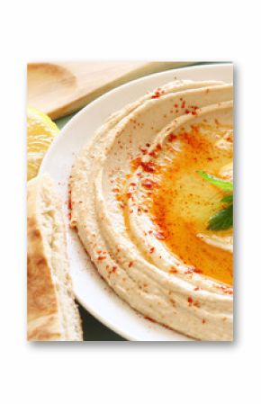 hummus dip plate and lemon on wooden table