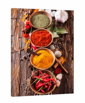Various spices on wood
