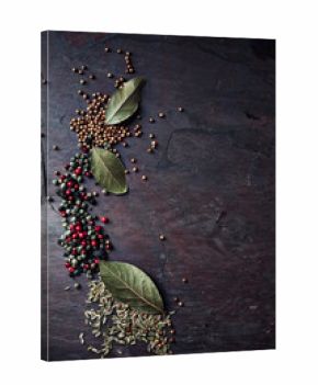 Assorted spices on a stone background