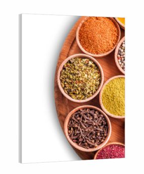 assorted spices in a wooden bowl