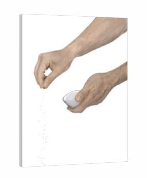 Tw male hands adding crushed salt on a white background