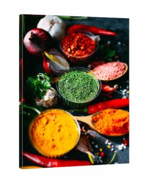set of different spices on the black table