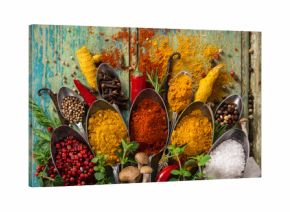 Various colorful spices on wooden table