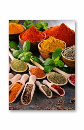 Variety of spices and herbs on kitchen table
