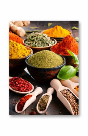 Variety of spices and herbs on kitchen table