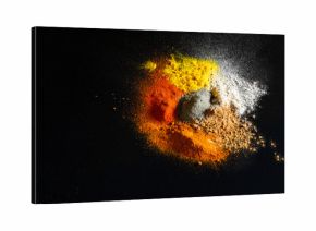 Spilled powder spices on black