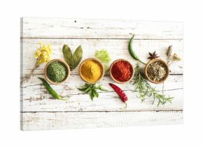 Spices and herbs on wooden background