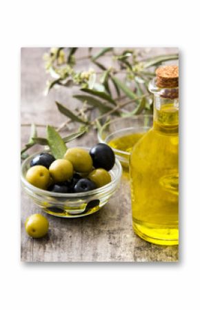 Virgin olive oil in a crystal bottle on wooden background  