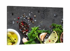 Selection of spices herbs and greens. Top view black background. Long banner format